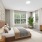 Bedroom with natural lighting and high ceilings