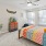 Bedroom with natural lighting and high ceilings
