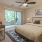 Bedroom with natural lighting and high ceilings