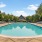 Resort-style swimming pool with lounge seating